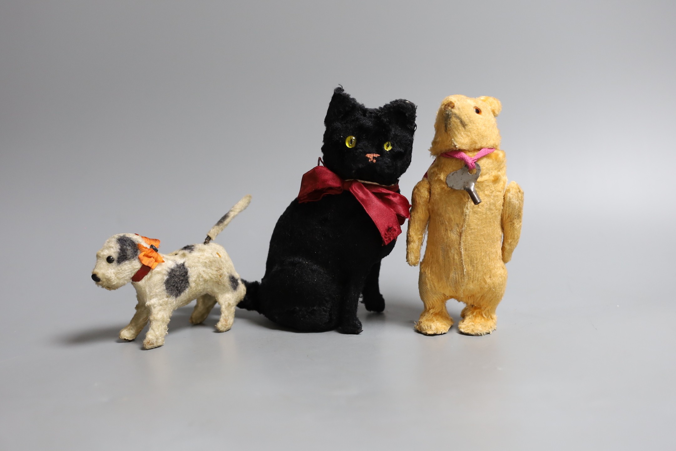 Three children's clockwork toys, a black cat, bear and a dog, car 16cms high